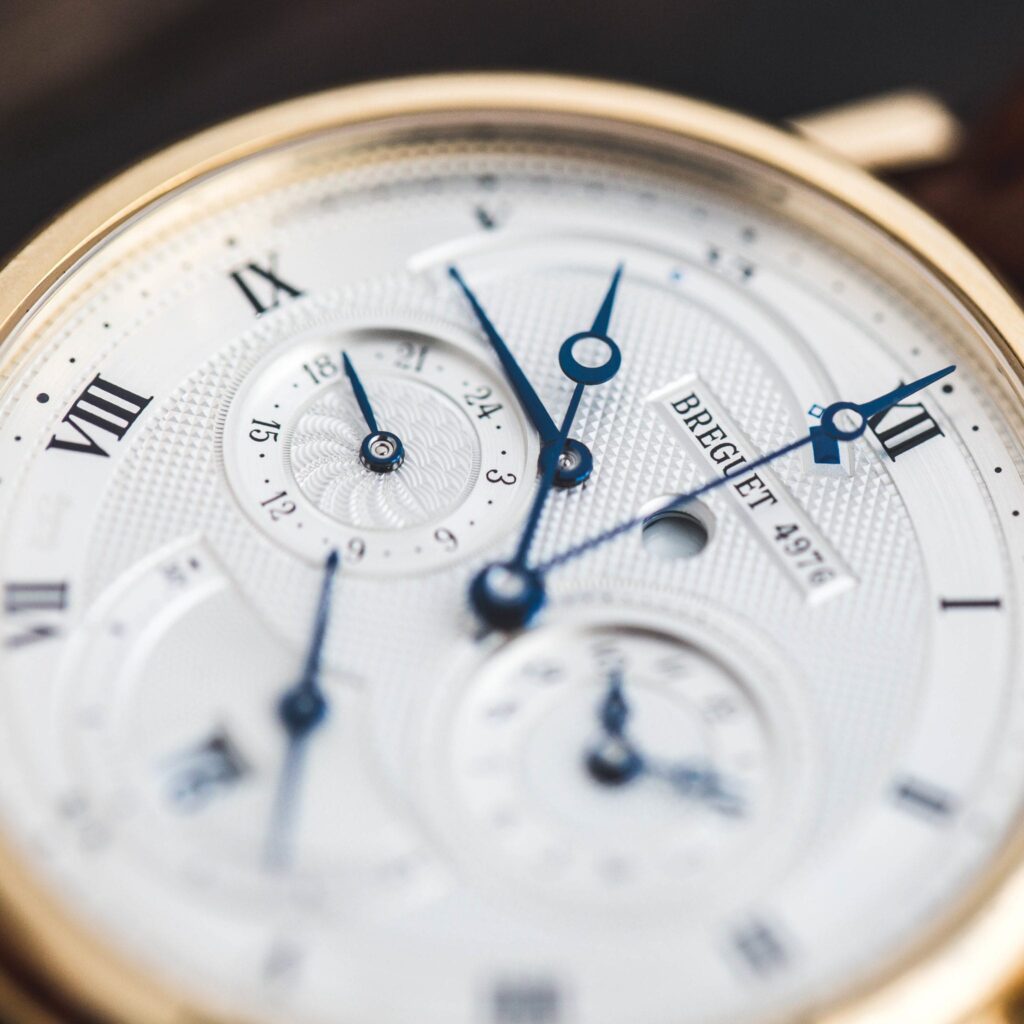 A gold case, white dial Breguet with blue Breguet hands 