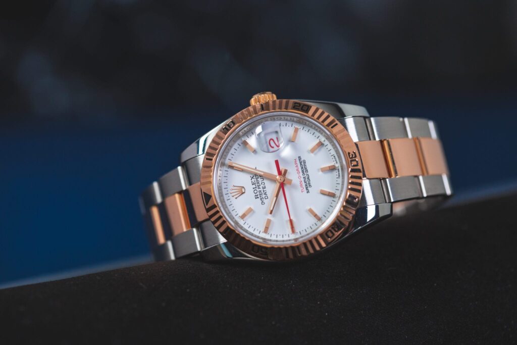 A Rolex Turn-O-Graph with a white dial and red seconds hand