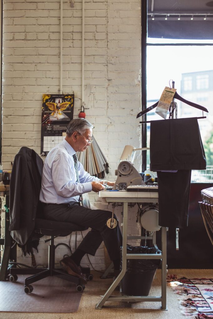 A tailor working in the Sid Mashburn store 